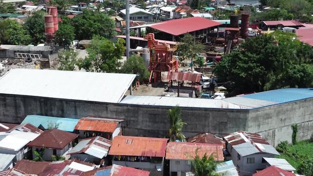 Aerial footage of urban residential environment and tightly packed buildings in Cebu City Philippines.