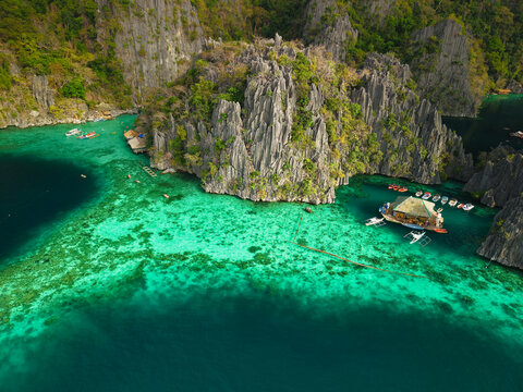 Twin Lagoon, located on Coron Island in Palawan, Philippines, is a breathtaking natural attraction featuring two crystal-clear lagoons separated by a dramatic limestone wall.
