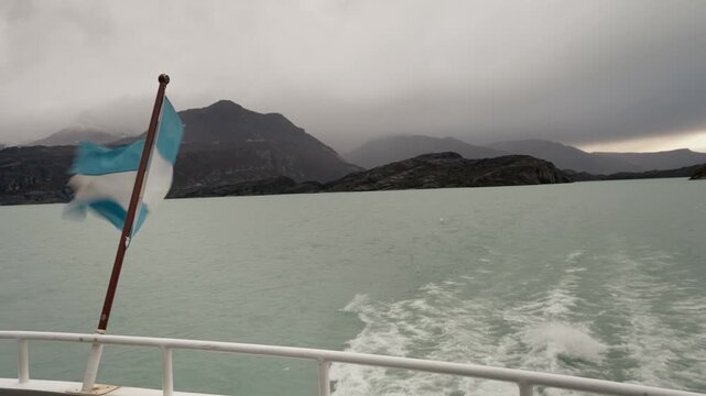 Argentine Flag Waving from Boat Sailing on Lago Argentino in Patagonia