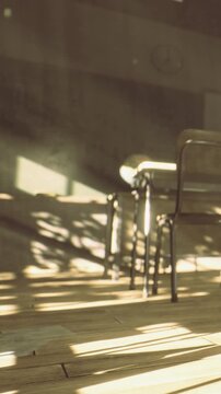 Sunlight shines through windows, casting shadows on the floor and a desk in an empty classroom. The scene shows a globe on the desk, creating a quiet learning space.
