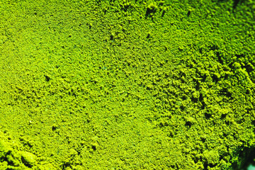 textured surface of green matcha powder  natural background perfect for health, food, or branding...