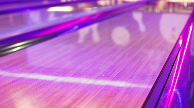 Bowling club play, group team of friends and colleagues playing, throwing a ball on the bowling alley lane, ball and pins, corporate party event in a mall amusement game center, tournament competition