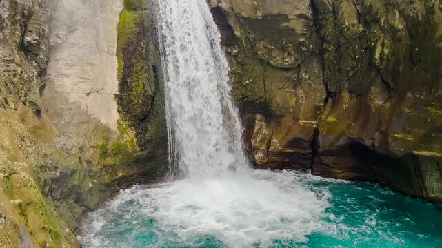 Scenic waterfall cascading through rocky Sapadere Canyon in Turkey surrounded by lush greenery