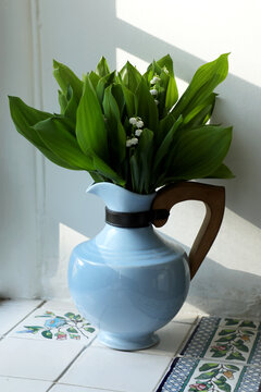 LIly of the valley bouquet on window sill.