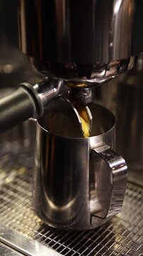 A professional bartender prepares fresh coffee in a stylish caf&eacute; atmosphere. Close-up details, steam, coffee aroma, and cinematic lighting create a cozy premium hospitality scene perfect for caf&eacute;s, re