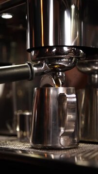 A professional bartender prepares fresh coffee in a stylish caf&eacute; atmosphere. Close-up details, steam, coffee aroma, and cinematic lighting create a cozy premium hospitality scene perfect for caf&eacute;s, re