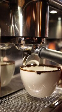 A professional bartender prepares fresh coffee in a stylish caf&eacute; atmosphere. Close-up details, steam, coffee aroma, and cinematic lighting create a cozy premium hospitality scene perfect for caf&eacute;s, re