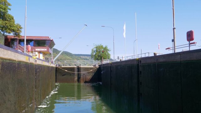 Winch lifting mooring rope in canal lock