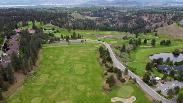 drone aerial pan of golf courses over Kelowna Okanagan