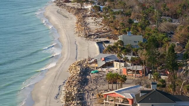 Destroyed houses on ocean coast. Hurricane Milton consequences in Englewood, Florida. Storm surge severe damage.