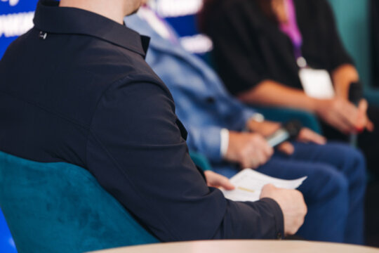 Panel discussion at conference, group of speakers debate at the business conference event, audience on forum summit, plenary session in lecture hall, persons on a stage, business congress at the venue