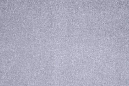 Close-up of Light Grey Woven Fabric Texture Background.