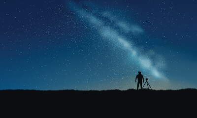 Fototapeta premium A photographer in starry night with milky way