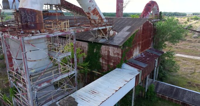 Derelict Mosaic Phosphate Plant with decaying machinery, rusted pipes and concrete ruins in Polk County, Florida.