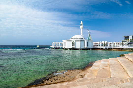 Scenic view of Al Rahmah Mosque, a beautiful white mosque built on stilts over the Red Sea in Jeddah, Saudi Arabia, a testament to architectural ingenuity