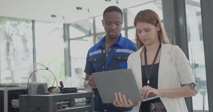 Engineer and Product Designer Reviewing Technical Blueprints