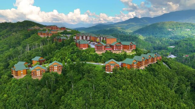 Beautiful homes in Gatlinburg, Tennessee nestled in the Great Smoky Mountains with scenic forest landscape and summer colors