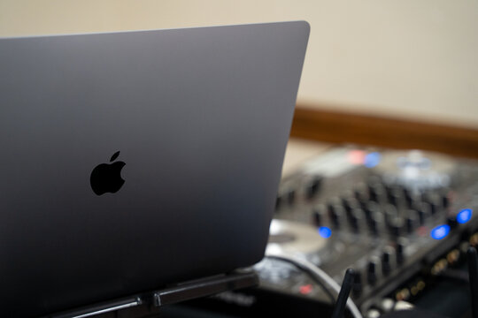 Apple MacBook laptop connected to professional audio mixer. Toronto, Canada - May 9, 2026.