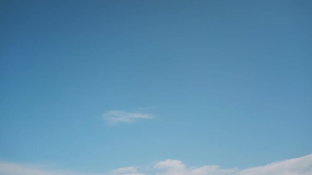 Beautiful blue sky with distant thin clouds and gradient
