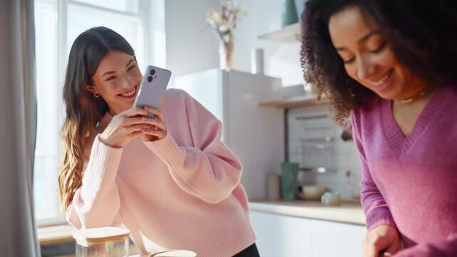 Group friends cooking together in kitchen closeup. Smiling woman recording video