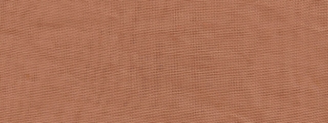 Fototapeta premium Terracotta linen fabric texture, rustic orange textile background, close-up of woven natural cotton material for interior design and fashion
