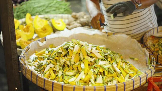 Street Vendor Chopping Vegetables and Arranging Produce for Pinakbet at Roadside Stall