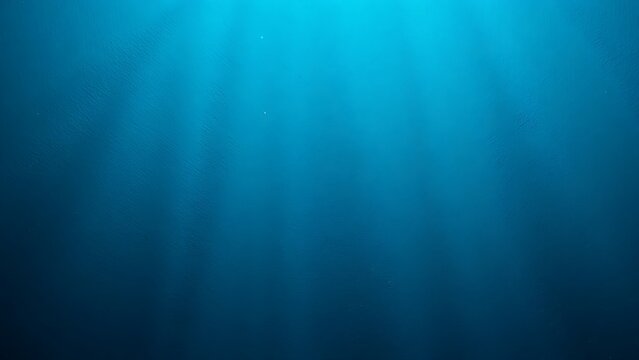 Deep blue ocean underwater background with light rays for creative design, digital website banner and page, clean minimalist corporate presentation templates
