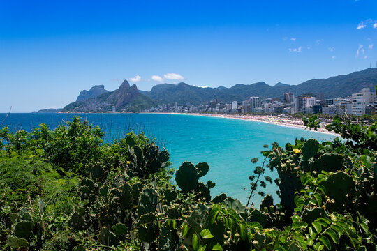 View from the Arpoador rock formation and vegetation overlooking the beautiful turquoise beaches of Rio de Janeiro - Brazil.