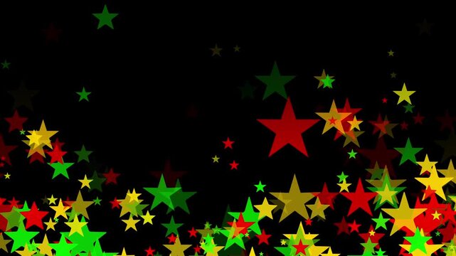 Stars floating upward in bold red, yellow, and green colors on black background for Juneteenth, or Freedom Day, to commemorate the ending of slavery on June 19th 1865 in the United States of America.