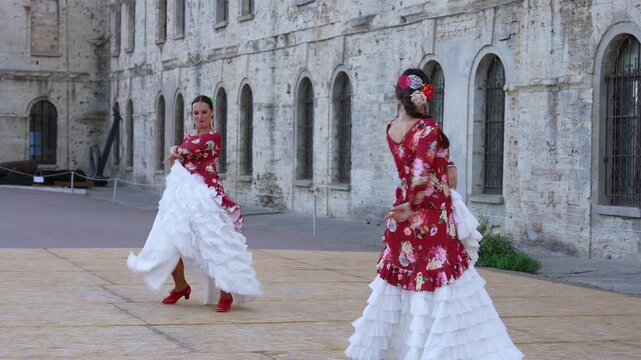 Flamenco Dancers Dancing in Red on Spanish Street
