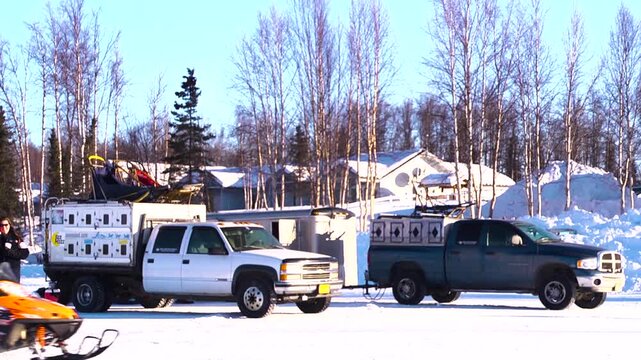 iditarod dog team truck arriving to the starting line