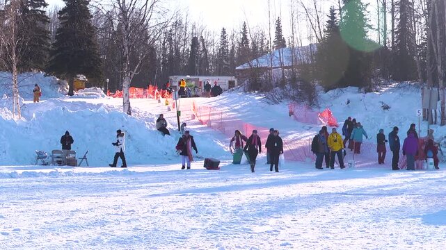 group of people in winter preparing for the iditarod