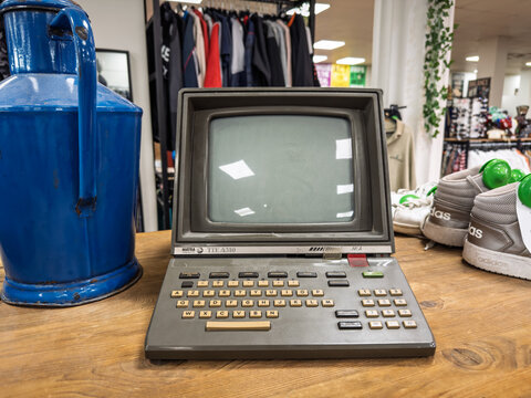 MARSEILLE, FRANCE - SEPTEMBER 29, 2025: Minitel terminal displayed on a wooden table in Marseille, France, Minitel was a pioneering, pre-World Wide Web online service launched in France in the 1982.