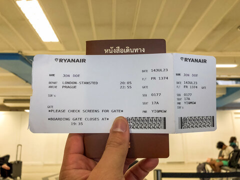 London Stansted Airport, United Kingdom, 14 July 2023, Close up of an example John Doe Ryanair boarding pass held in hand.