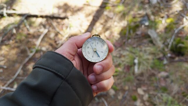 Hiker Holding Compass In Forest Sunlight Concept Of Personal Growth Journey Adventure Travel Navigation Direction Active Lifestyle Wilderness Nature 4K 