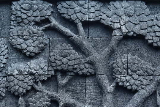 This carved stone relief is made from materials such as natural stone, sand, and cement. Traditional Motif The design resembles the relief style found in temples in East Java, such as Penataran Temple