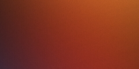 Fototapeta premium Abstract texture background with vibrant orange and red gradient, speckled surface resembling fine grain or dust.