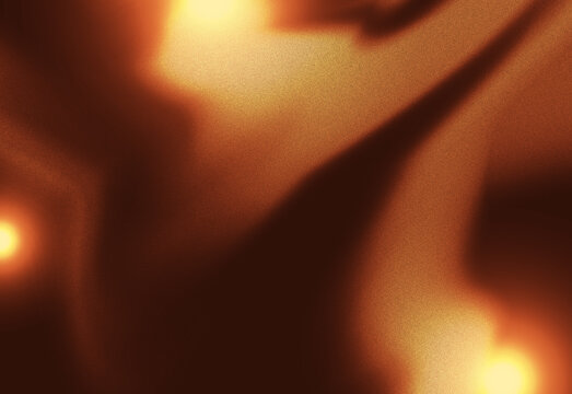 Warm golden blur background with bright glowing corners, deep brown shadows, and subtle grain for elegant creative projects.