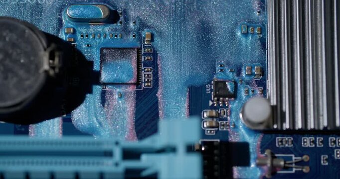 Pigment defocused leak. Microprocessor details. Sparkling blue ink spill on computer electronic plate. Device system abstract color background.