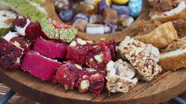 Assortment of Colorful Turkish Delight on a Wooden Platter