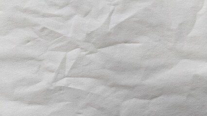 Fototapeta premium Crumpled white paper texture background with creases and wrinkles