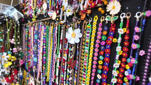 Colorful handmade bracelets at market in the afternoon