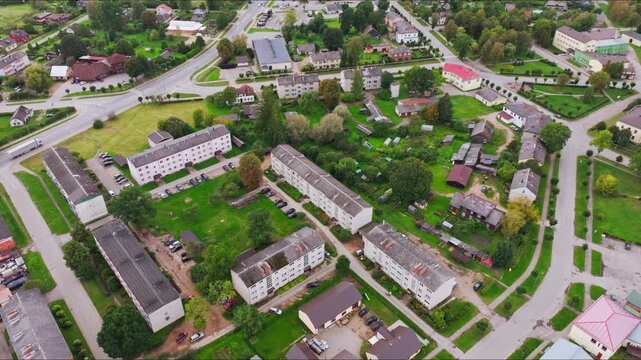 Skrunda town Latvia drone flying low and closer with tilt up, urban landscape