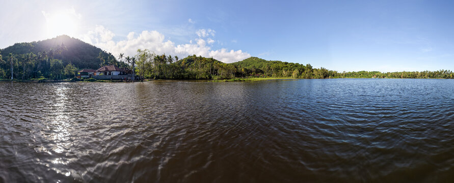 Panoramic View of Lake Yeh Malet in Karangasem Bali with Hills and Sunny Sky
