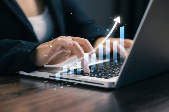 Business growth analytics concept with financial chart and rising graph overlay on laptop keyboard, showcasing digital marketing strategy, data analysis, investment growth and corporate success.