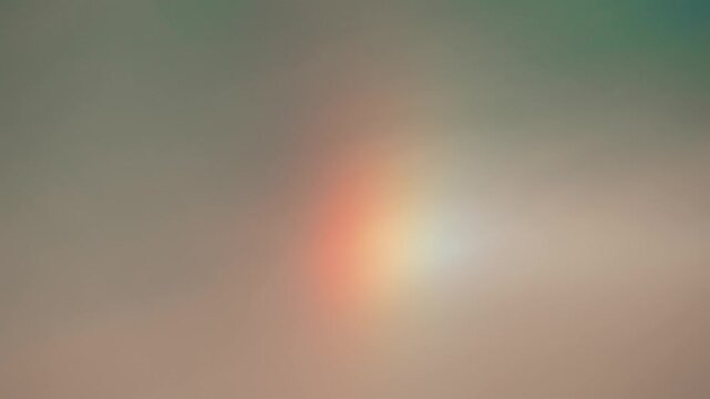 Sun dog atmospheric optical phenomenon in cloudy sky.