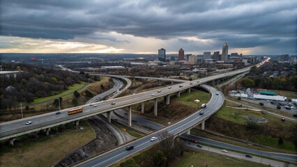 Fototapeta premium Aerial view of highway and overpass in city on a cloudy day 