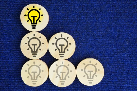 Light bulb icons on wooden toy stack for creative idea innovation of business plan analyzing. no idea to have an idea. smart, creative, idea thinking to innovation brainstorm and imagination learning 