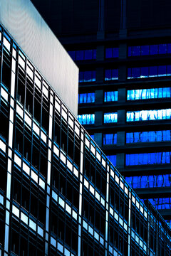 Abstract architectural close-up of modern skyscrapers in Tokyo with geometric lines.
