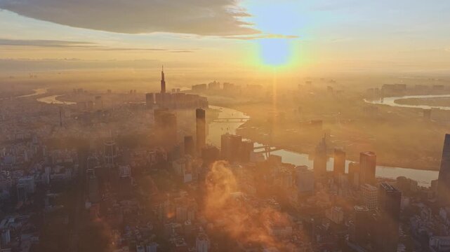 Cinematic aerial drone view of Ho Chi Minh City at dramatic sunset sky, Vietnam